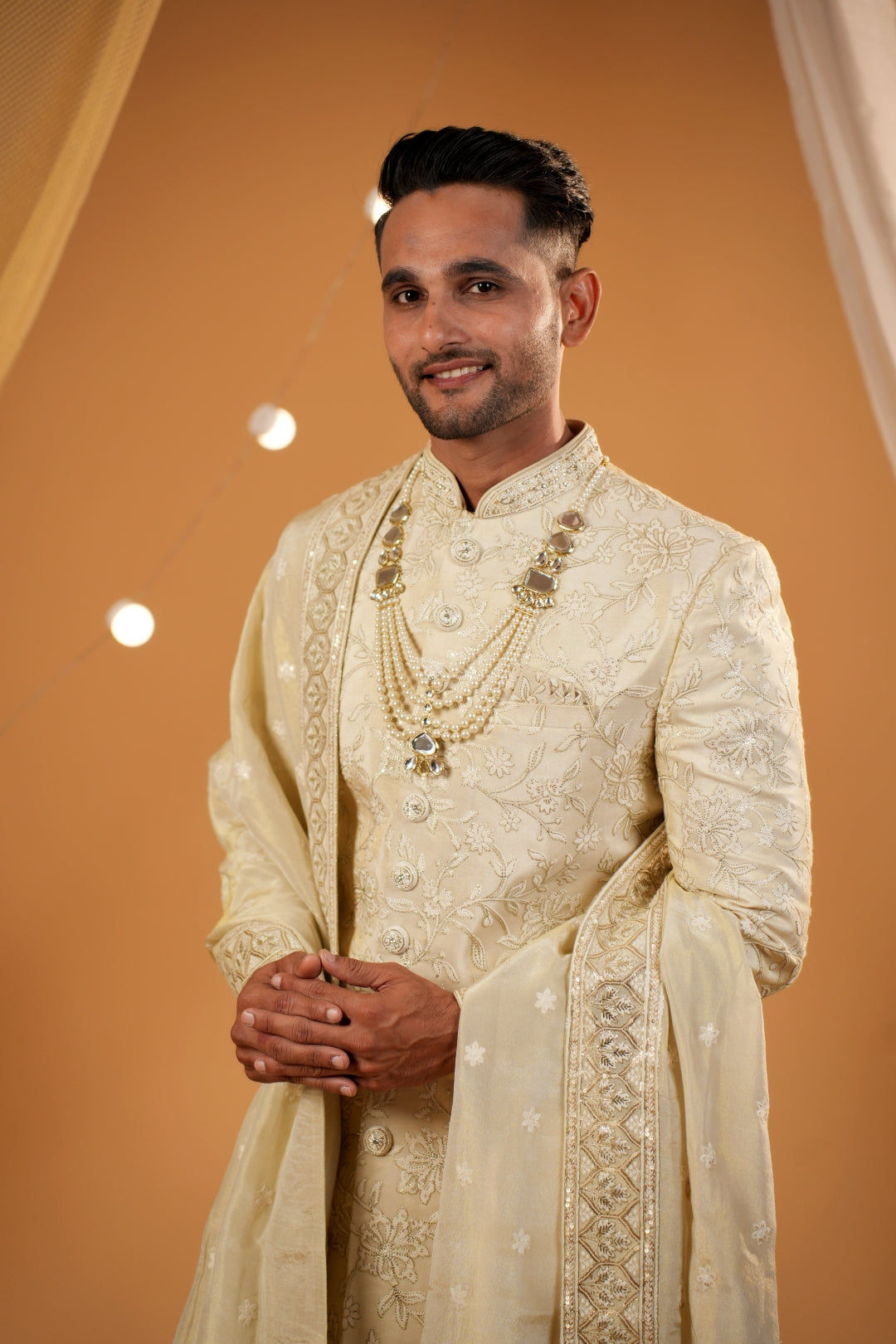 Golden floral thread embellished sherwani with matching bottom and beautiful handwork dupatta